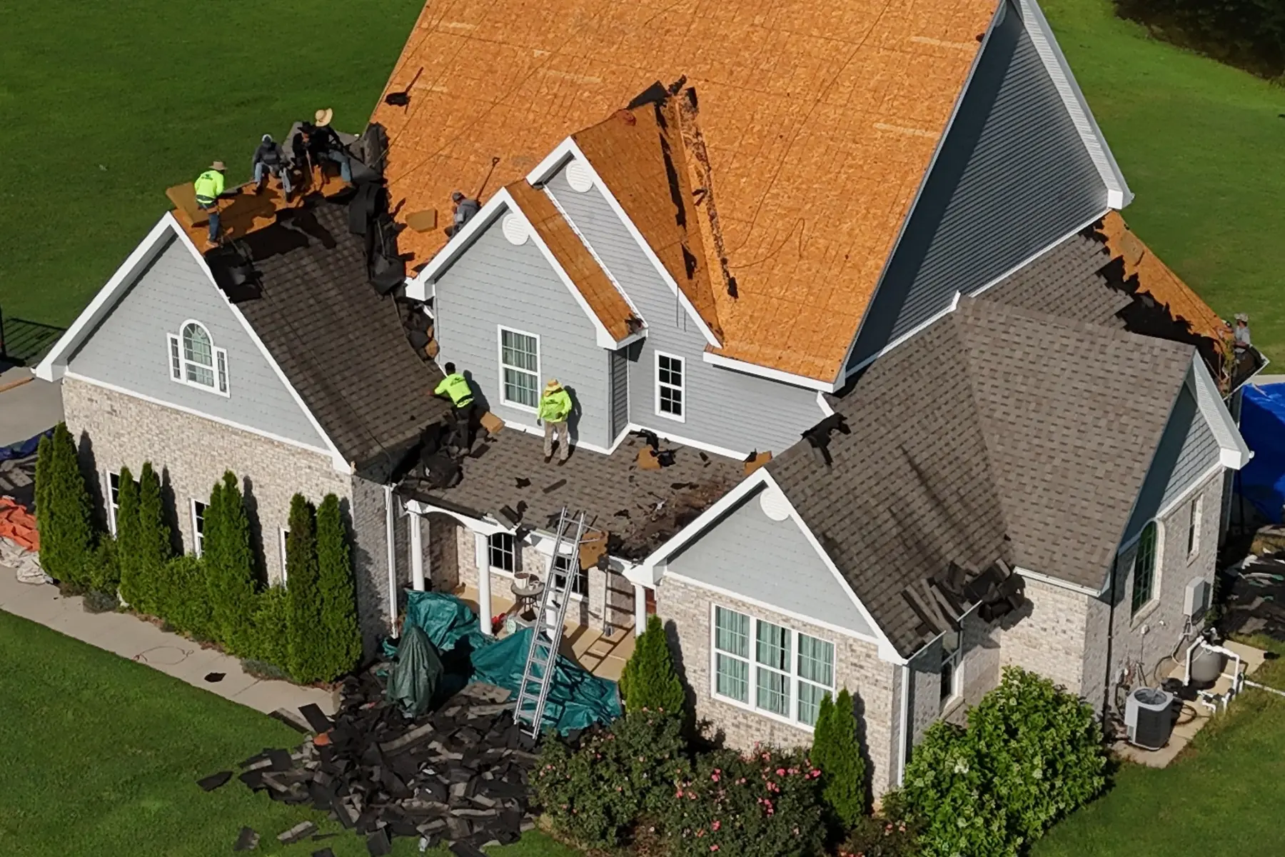 Delta Roofing crew replacing shingles on a Northeast Arkansas home